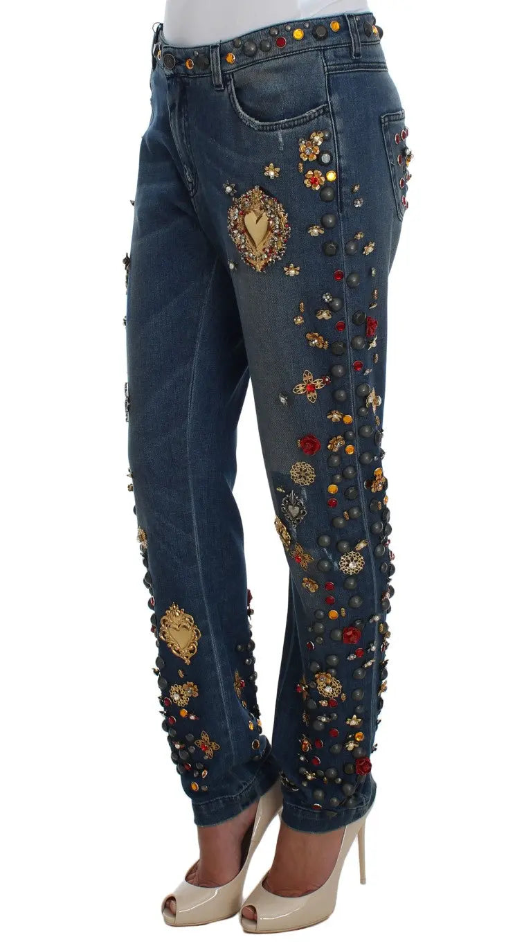 Dark blue boyfriend jeans with crystal rose and heart embellishments and rolled cuffs.
