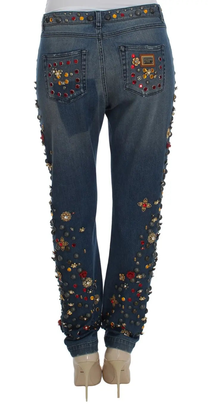 Dark blue boyfriend jeans with crystal rose and heart embellishments and rolled cuffs.
