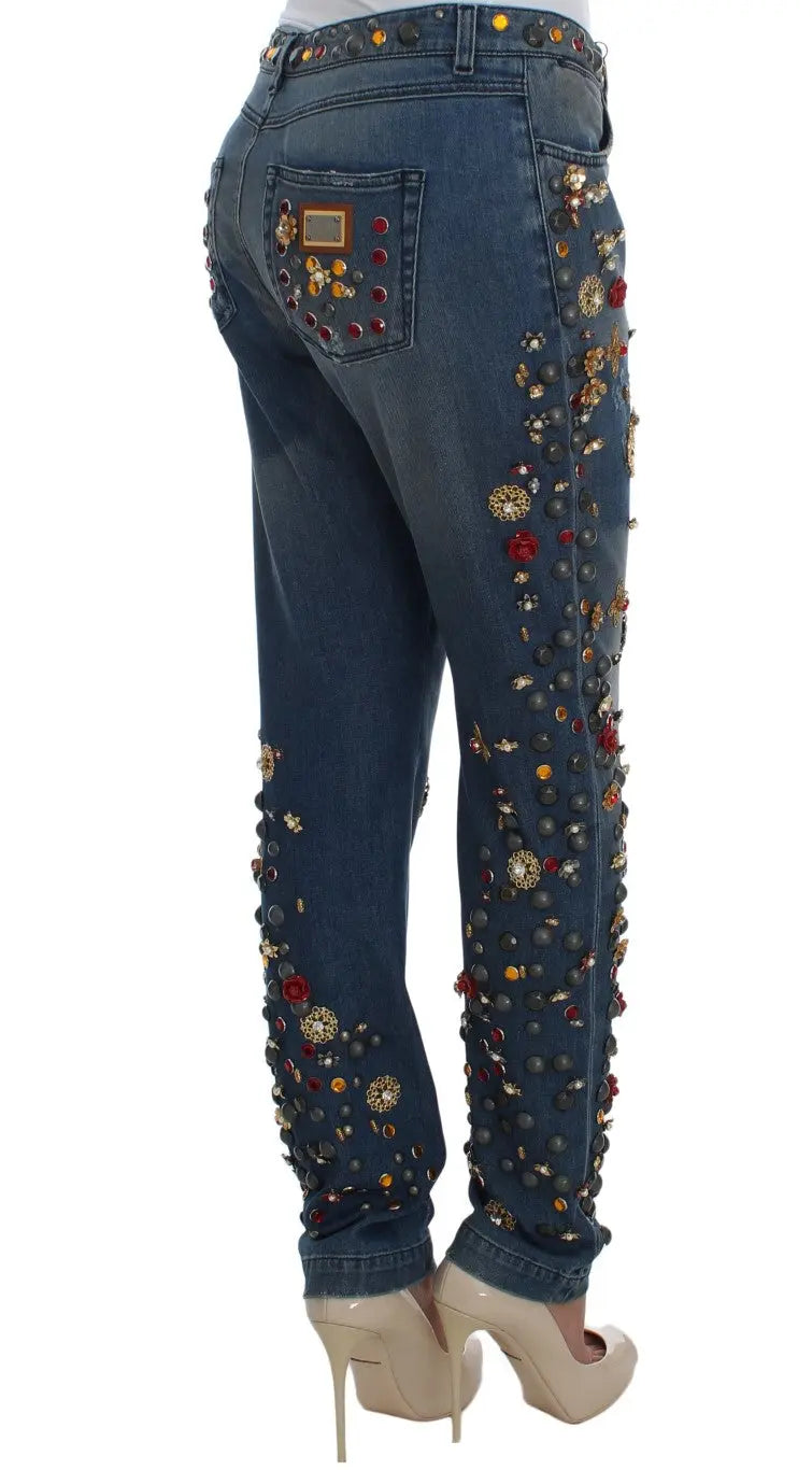 Dark blue boyfriend jeans with crystal rose and heart embellishments and rolled cuffs.