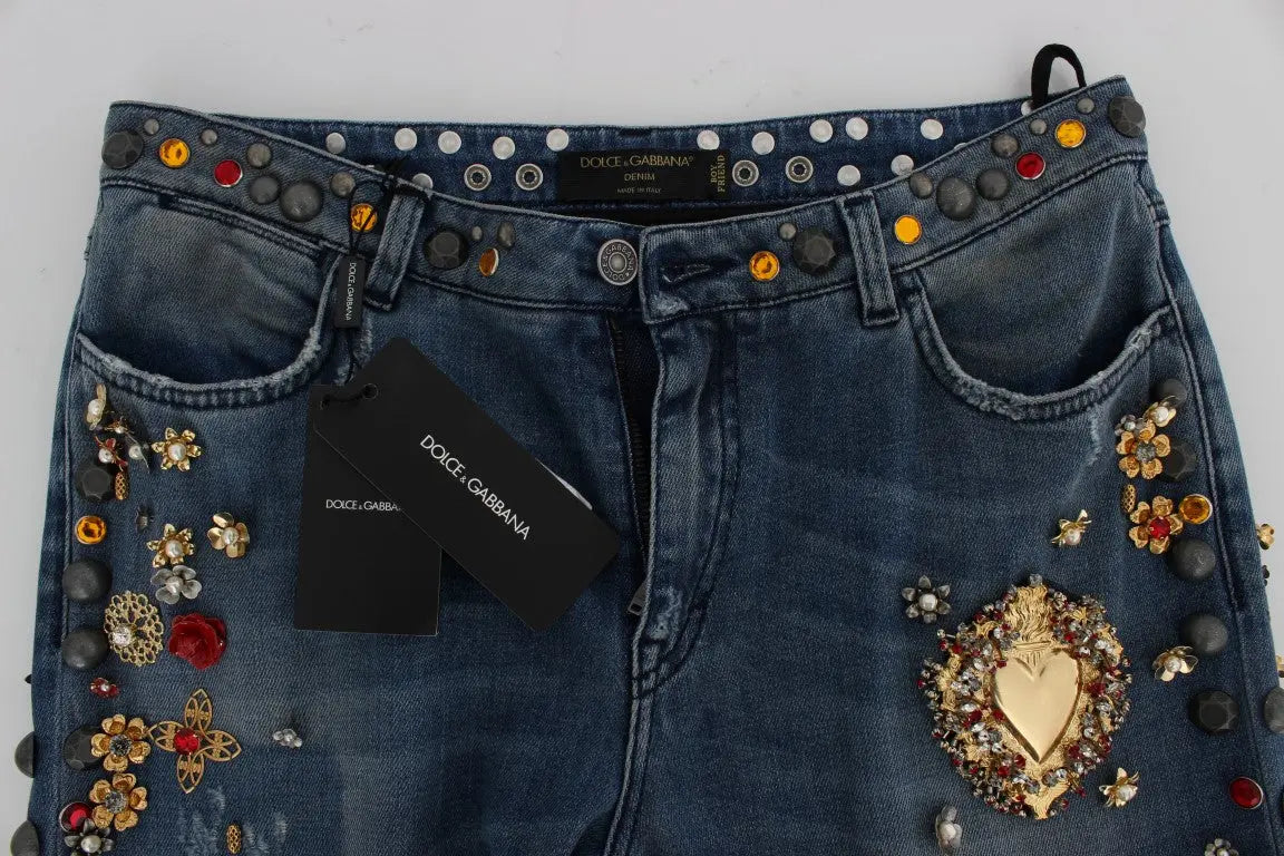 Dark blue boyfriend jeans with crystal rose and heart embellishments and rolled cuffs.