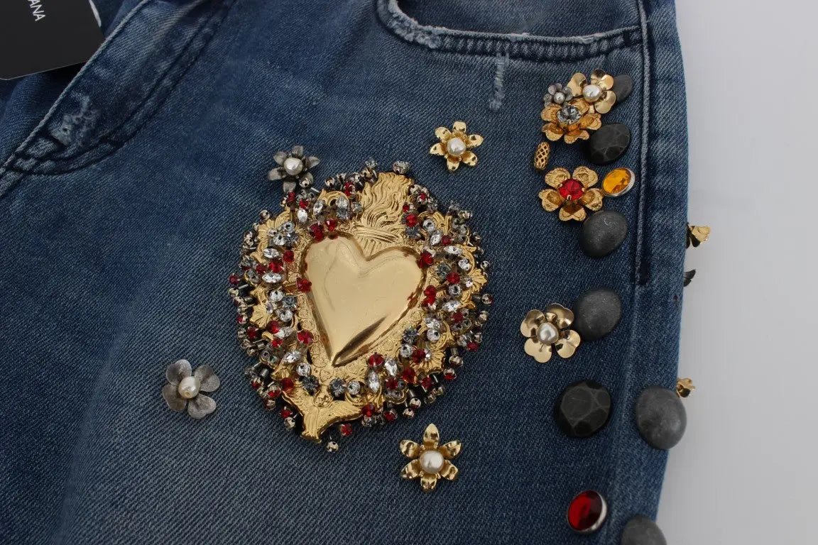 Dark blue boyfriend jeans with crystal rose and heart embellishments and rolled cuffs.