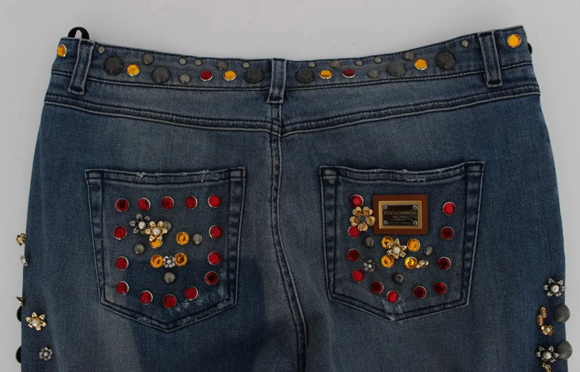 Dark blue boyfriend jeans with crystal rose and heart embellishments and rolled cuffs.