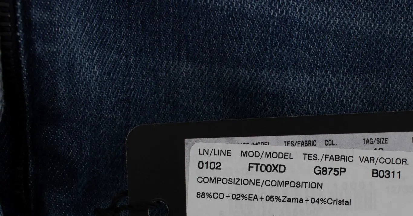 Dark blue boyfriend jeans with crystal rose and heart embellishments and rolled cuffs.