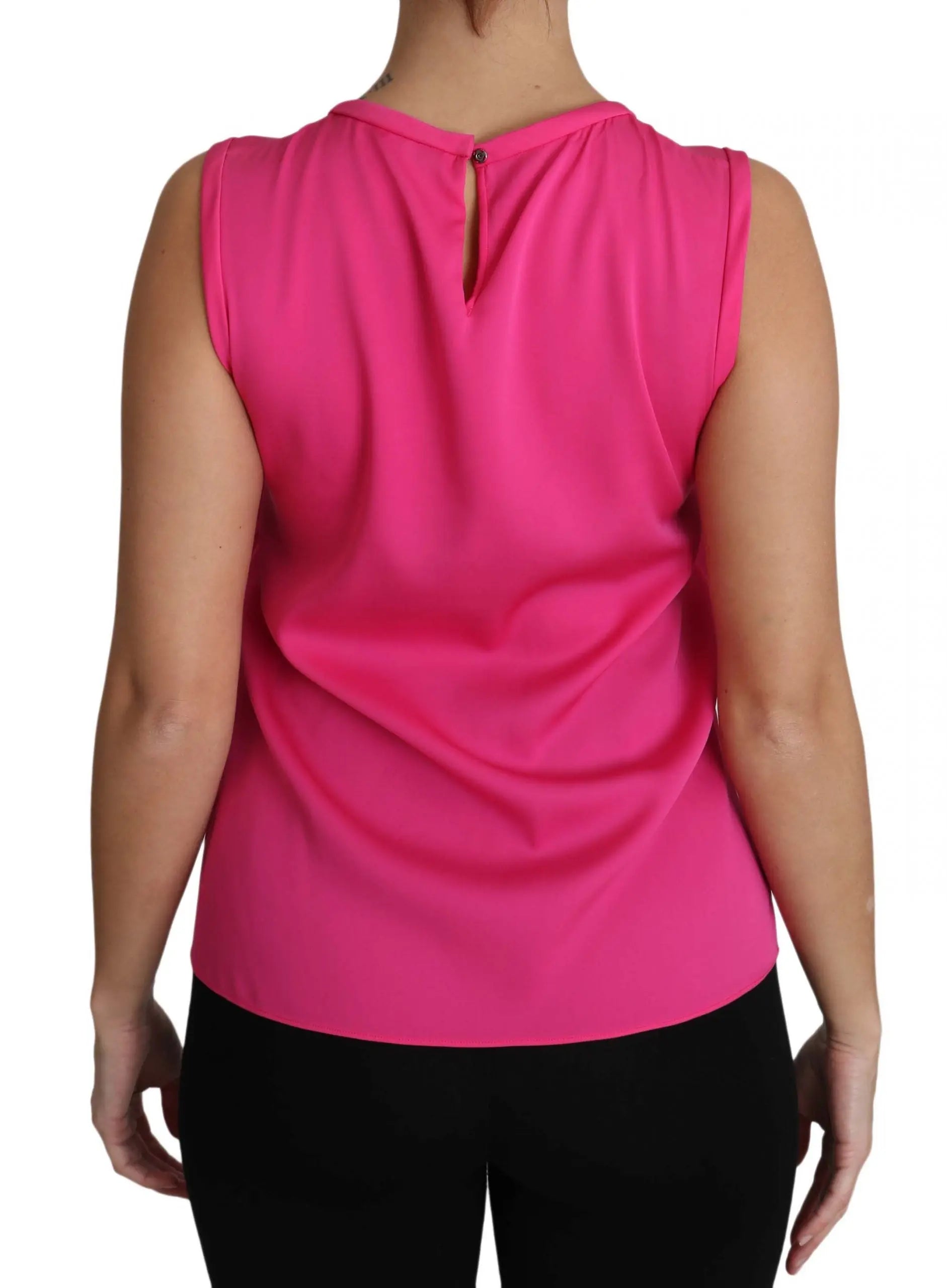 Pink sleeveless silk tank top with a bow tie neckline and colorful embroidered characters on the front.
