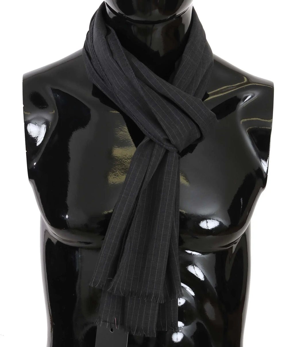 Gray wool scarf with subtle vertical stripe pattern and fringed ends wrapped around a black mannequin bust.