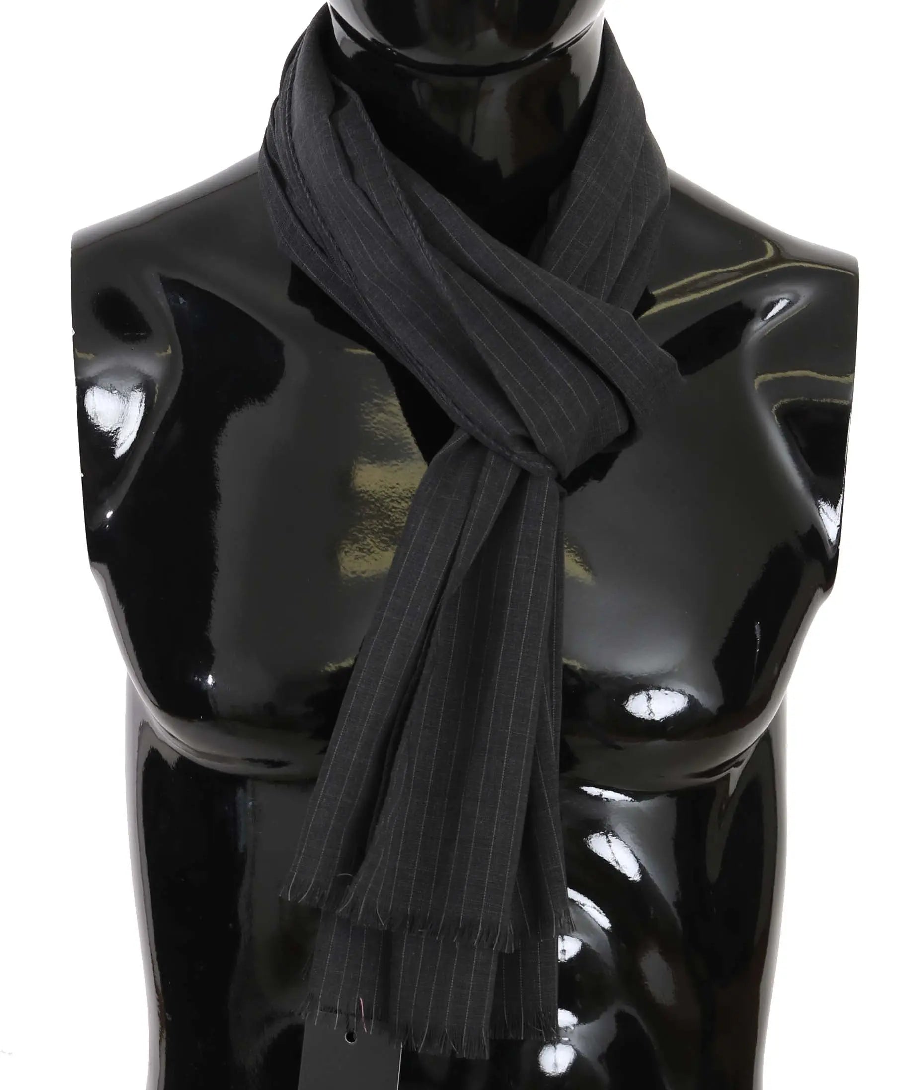 Gray wool scarf with subtle vertical stripe pattern and fringed ends wrapped around a black mannequin bust.