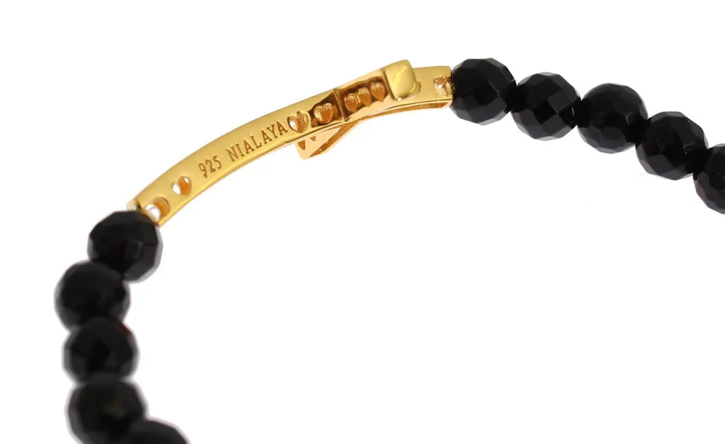 Black faceted agate bead bracelet with gold-plated 925 silver cross pendant encrusted with clear CZ stones.